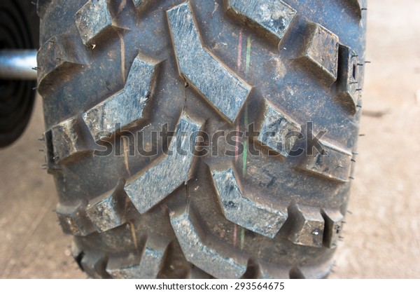ATV tires are big and thick.big tractor\
wheels.tractor tire, selective focus. \
