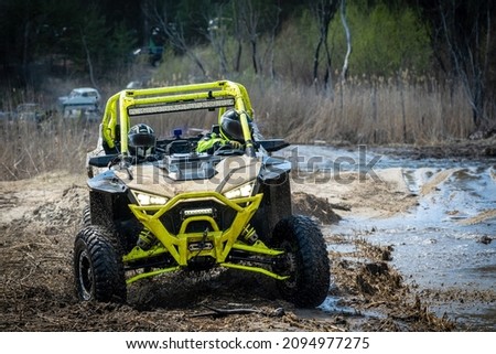 ATV and UTV offroad vehicle racing in hard track with mud splash. Extreme, adrenalin. 4x4.