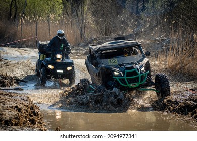 ATV And UTV Riding In Hard Track With Mud Splash. Amateur Competitions. 4x4.