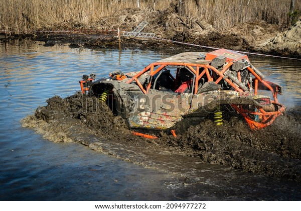 ATV and UTV riding in hard track with mud splash.\
Amateur competitions. 4x4.