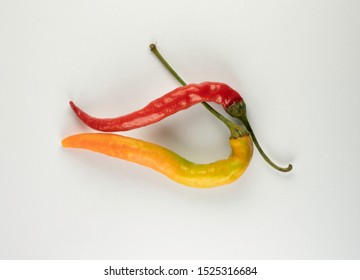 Atypical couple of chilli peppers  - Powered by Shutterstock