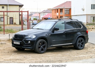 Atyrau, Kazakhstan - October 11, 2022: Black Luxury Crossover BMW X5 (E70) In The City Street.