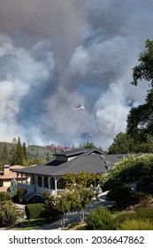 AUBURN, CA, U.S.A. - AUG. 5, 2021: Photos of a Cal Fire helicopter flying over the Foresthill Fire, in the Sierra Nevada mountains, near Auburn.