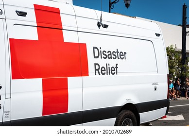 AUBURN, CA, U.;S.A. - JULY 4, 2021: Photo of the side of a white Red Cross disaster relief van during a small town July 4 parade.  The red cross is very active during the California wildfires.