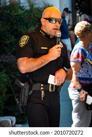 AUBURN, CA, U.;S.A. - JULY 4, 2021: Photo of Police Chief Ryan Kinnan speaking to the crowd prior to a salute to fallen service members during the small town's July 4 parade.