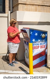 AUBURN, CA, U.S.A. - SEPT. 9, 2021: Auburn resident De Calvert returns her ballot to a Placer County ballot box during the fall election season.