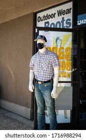 AUBURN, CA/U.S.A. - APRIL 28, 2020: Photo Of A Male Mannequin Wearing Jeans, Baseball Hat, Belt, Shirt  And A Black Mask At The Barebones WorkWear Store.  The Mask Is A Humorous Reference To COVID19.