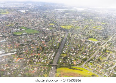 Auckland City Aerial, Suburban And Industrial Areas Below.