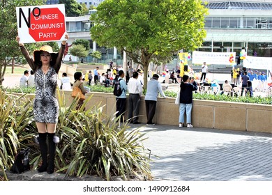 Auckland City / New Zealand - April 07, 2018: Woman Protests Against The Chinese Communist Party. 