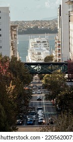 Auckland City Street Full Of Cars With The Port At The Back. New Zealand Travel Destination. Vertical Photo