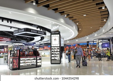 AUCKLAND - DEC 05 2017: Passengers passing through the new Auckland airport International departure duty free area.More then 10 million passengers use Auckland international terminal each year