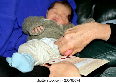 AUCKLAND - JUNE 09 2014:Midwife Takes Blood Sample From A Newborn During Metabolic Screening Test.Newborn Screening Samples Are Collected From The Infant Between 24 Hours And 7 Days After Birth.