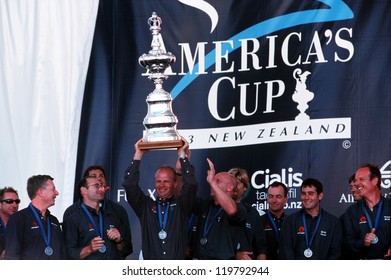 AUCKLAND - MARCH 1 2003:Team Alinghi Holds The Trophy Of The Americas Cup In Auckland New Zealand.It Was Contested Between Team NZ And The Winner Of The 2003 Louis Vuitton Cup Alinghi