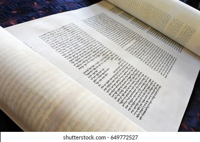 AUCKLAND - MAY 30 2017:The word of God in Torah scroll text. The Oral Torah was given to Moses from God at Mount Sinai, which, according to the tradition of Orthodox Judaism, occurred in 1312 BC.
