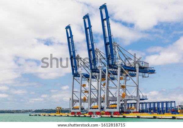 Auckland, New Zealand -\
1 January 2020: Gantry Cranes, made by Shanghai Zhenhua Heavy\
Industries Company Limited (ZPMC) at the Container Terminal of\
\