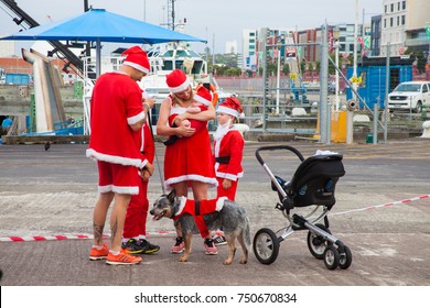 AUCKLAND, NEW ZEALAND - DECEMBER 2: Street of Auckland on December 2nd, 2015. Santa Run. Many people in Santa costumes run through the city.