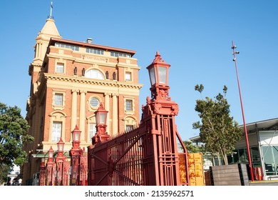 Auckland New Zealand - December 26 2015; Historic Ferry Building Downtown In City With Red Wrought Iron Fence And Lamps