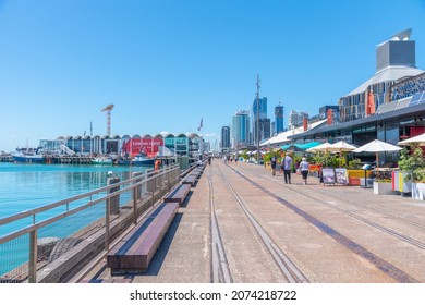 AUCKLAND, NEW ZEALAND, FEBRUARY 20, 2020: People are strolling on a waterfront of port of Auckland, New Zealand