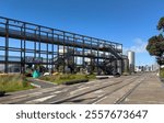 Auckland, New Zealand. The Gantry structure at Silo Park, Wynyard Quarter on the waterfront, a 100 metre long steel structure for the public to climb and take in the views.