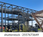 Auckland, New Zealand. The Gantry structure at Silo Park, Wynyard Quarter on the waterfront, a 100 metre long steel structure for the public to climb and take in the views.