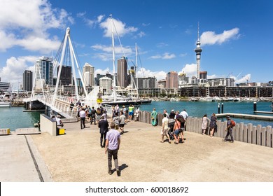 AUCKLAND, NEW ZEALAND - MARCH 1, 2017: People Cross The Bridge That Links The Wynyard District To The Viaduct Marina In Auckland, New Zealand Largest City.