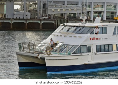 Auckland / New Zealand - March 13 2019: Skipper and deckhand preparing Fullers ferry to dock