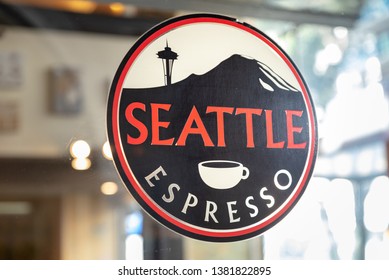 Auckland, New Zealand - May 16, 2018: Close Up Of The Seattle Espresso Coffee Shop Sign. The Sign Shows A Red Circle Around A Silhouette Of The Seattle Space Needle And Mount Rainier.