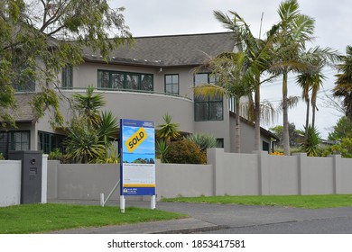 AUCKLAND, NEW ZEALAND - Nov 04, 2020: View Of Suburban House In Howick With Sold Sign On Cloudy Day