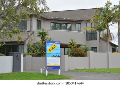 AUCKLAND, NEW ZEALAND - Nov 04, 2020: View Of Suburban House In Howick With Sold Sign On Cloudy Day