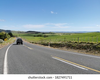 Auckland / New Zealand - October 3 2020: View Of Black Pickup Truck Driving Away On Rural Road