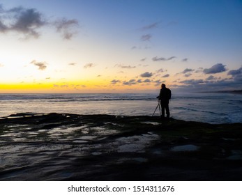 Auckland, New Zealand - September 21 2019: Elderley Photographer By Ocean Sunset - Powered by Shutterstock