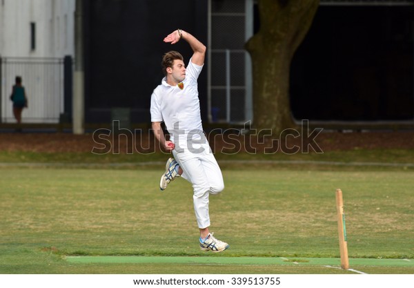 AUCKLAND - NOV 14 2015:Cricket player bowler\
reaches his delivery stride in Victoria park. Shoaib Akhtar of\
Pakistan holds the world record for delivering the fastest ball\
(161.3 Kilometres per\
hour)