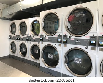 Auckland NZ 1 May 22: Liquid Self Service Laundromat Rows Of Commercial Washers And Dryers For Cleaning Clothes Blanket Card Laundry 