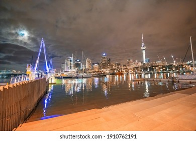 AUCKLAND, NZ - AUGUST 26, 2018: Waterfront Bridge And Buildings At Night.