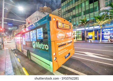 AUCKLAND, NZ - AUGUST 26, 2018: Downtown City Buildings And Bus Traffic At Night.