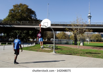 AUCKLAND, NZ - MAY 27: :Young Men Play Basketball In Victoria Park On May 27 2013.Basketball Is One Of The Most Popular Sports In The World.