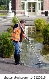 AUCKLAND, NZL - MAY 29 2013:Swimming Pool Service Technician In  Auckland Domain Wintergardens .there Are About 15,000,000 Residential Pools And Spas In The United States