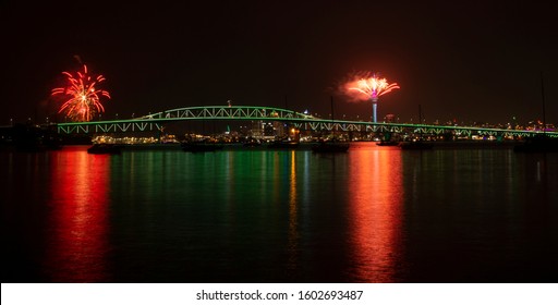 Auckland Sky Tower Fireworks For New Year Celebration With Illuminated Harbour Bridge 