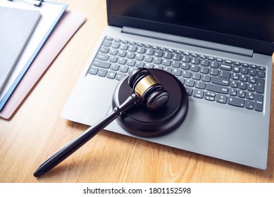Auction hammer on a laptop, online auction concept illustration - Shutterstock ID 1801152598