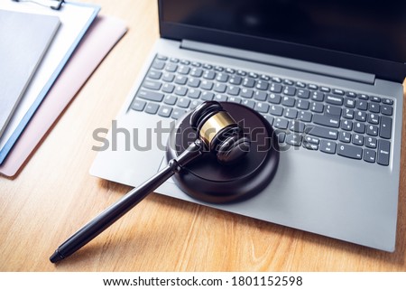 Auction hammer on a laptop, online auction concept illustration