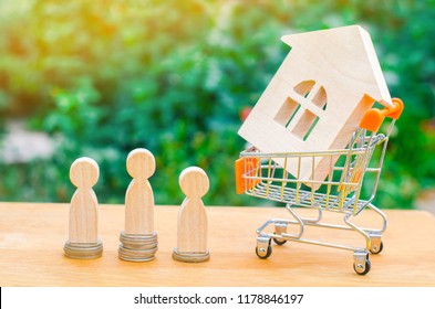 Auction, Public Sale Real Estate. Wooden House, Supermarket Trolley, People. Buying, Selling And Renting A House. Loan For An Apartment, Mortgage Rate. Affordable Housing For Young Families.