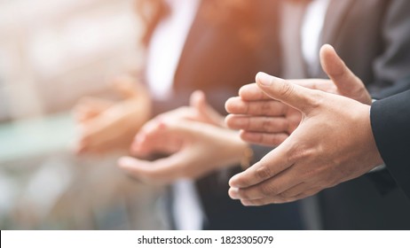 Audience applauding at a business appreciation. People congratulation and clapping hands at conference and presentation.  - Shutterstock ID 1823305079
