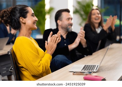 Audience Applauding  Professional business people - portrait brazilian business woman lapplauding at board of directors metting. Teamwork. Business people applaud - Powered by Shutterstock