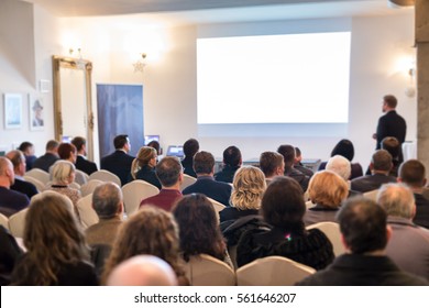 Audience at the conference hall. Speaker giving a talk on corporate Business Conference. Business and Entrepreneurship event. - Powered by Shutterstock