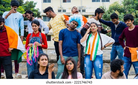 Audience With Indian Flags And Wigs Got Sad Due To Loss Of Wicket While Watching Cricket Sports Match At Stadium - Concept Of Curious, Disappointed And Intense Match