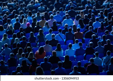 Audience Listens To The Lecturer At The Business Conference, Back View, Blue Tones