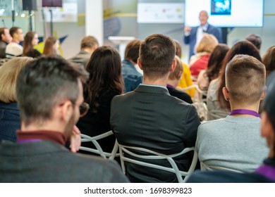 Audience listens lecturer at workshop in conference hall - Shutterstock ID 1698399823