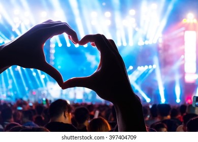 Audience At Live Music Concert Show A Heart Shaped Hands And Power Of Crowd