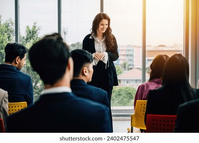 Audience participation in a seminar hands raised for questions during the interactive Q and A session demonstrating collaboration and active engagement. - Powered by Shutterstock