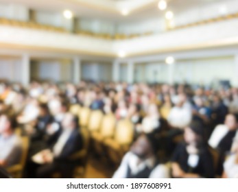 
Audience In A Performance Hall. Blurred Background Of An Audience In A Theater Or Auditorium